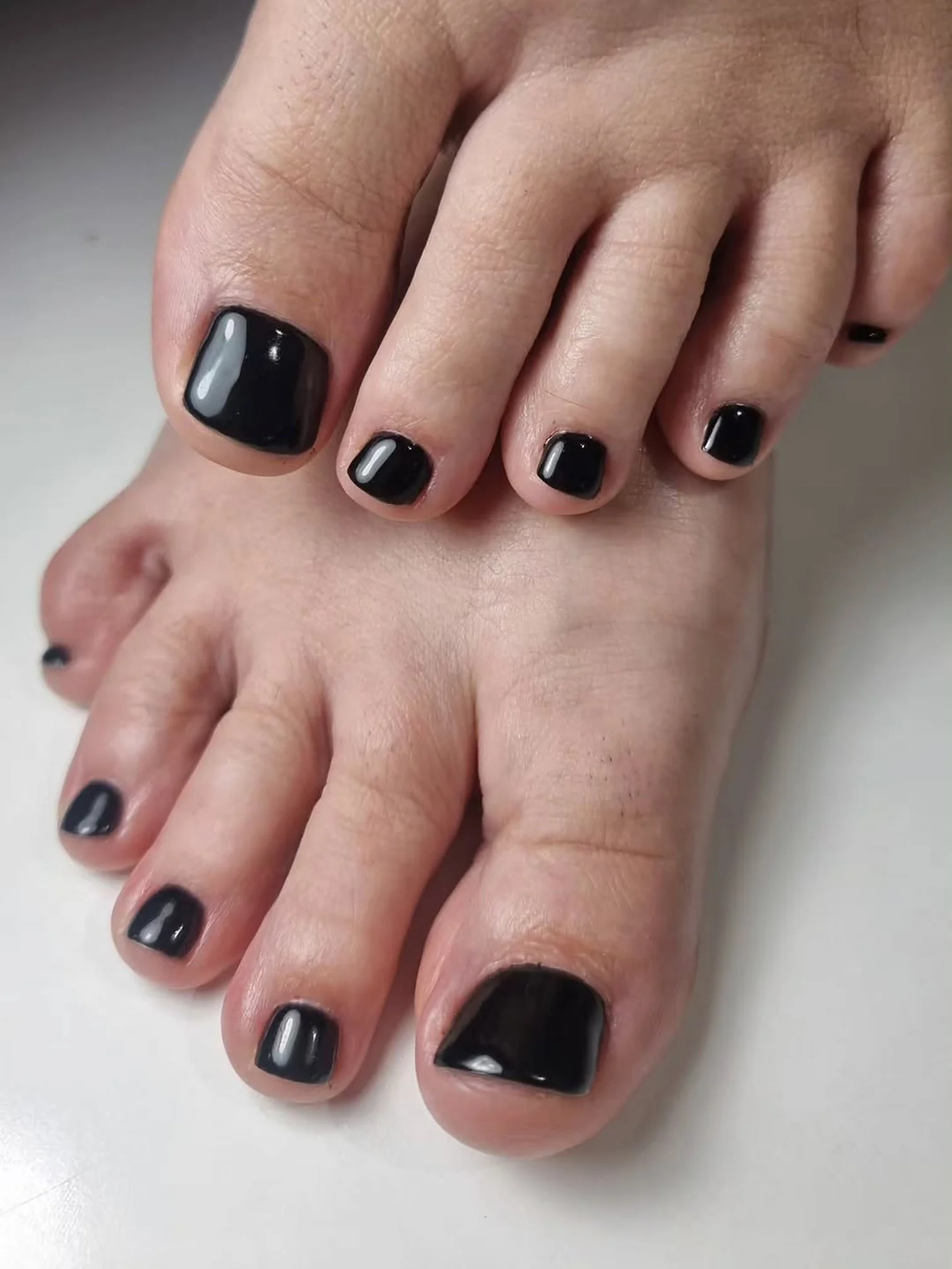 Glossy black pedicure